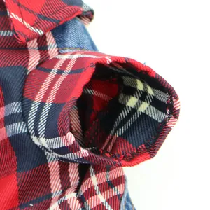 Close-up detail of red and blue plaid pet jumpsuit sleeve with inner lining
