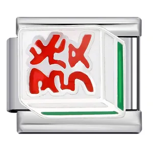 Close-up of a modular Italian charm with Chinese Mahjong Fa tile design in stainless steel
