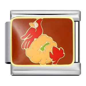 Detailed macro view of Thanksgiving modular charm with cardinal and pumpkin enamel