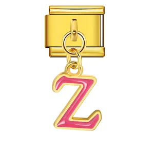 Detail view of a gold Italian modular charm with a pink enamel letter Z pendant
