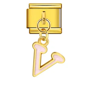 Detailed view of gold Italian charm with pink enamel letter V pendant