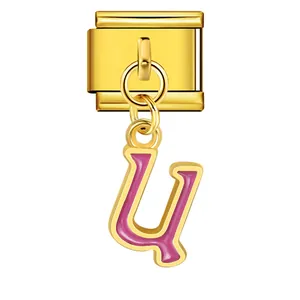 Detailed view of gold stainless steel modular charm with pink enamel letter U pendant.