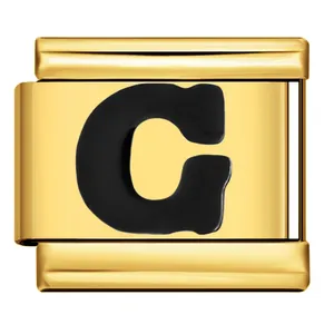 Detailed macro view of a golden stainless steel modular charm with black enamel letter C