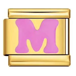 Close-up of gold stainless steel Italian charm link with pink enamel letter M for DIY