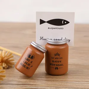 Creative mini jar-shaped wooden card holders for desk photos and notes display.
