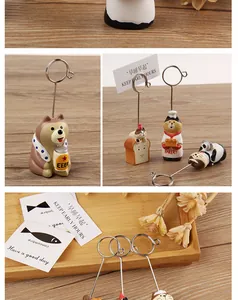 Close-up of cute resin animal memo holders with various designs for desk decoration.