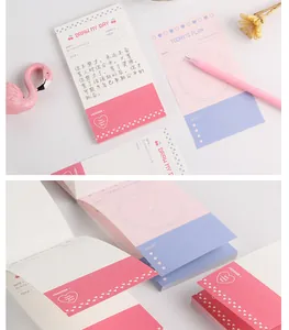 Close-up detail of Korean style aesthetic daily planner and memo notepad with pink accents