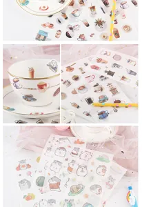 Close-up detail of cute cartoon coffee and hamster stickers for diary and journal decoration
