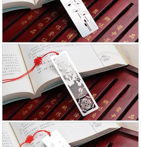 Close-up of a creative Chinese style hollow stainless steel metal bookmark on a book