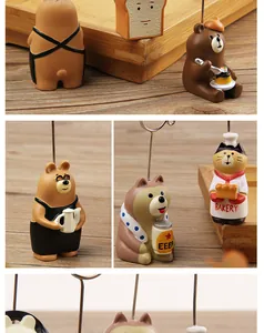 Close-up detail of various cute resin animal memo holders for desktop decoration