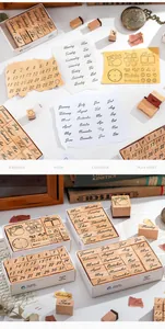 Detailed view of wooden calendar stamps featuring months and days for creative journaling.