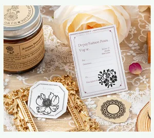 Close-up of vintage butterfly and flower series wooden stamp set for DIY hand accounts
