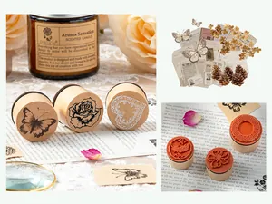 Detail view of vintage wooden cylindrical stamps with floral and butterfly patterns.