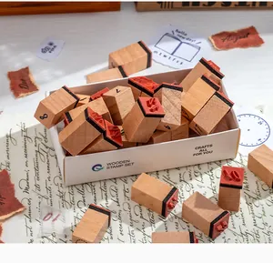 Detailed close-up of a wooden stamp set featuring numbers and months for journaling crafts