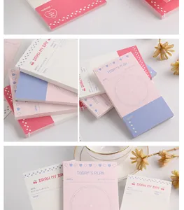 Detailed view of minimalist Korean tear-off memo pads with daily plan and mood sections.