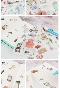 Detailed view of watercolor washi stickers applied on a grid notebook page