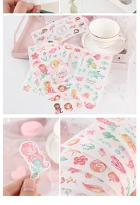 Detailed macro view of six sheets containing cute mermaid washi stickers for journaling decoration