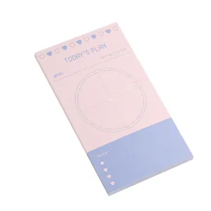 Minimalist pink and purple Korean style daily planner notepad shown from a side angle