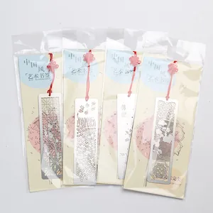 Elegant Chinese style hollowed metal bookmarks with red tassels and packaging