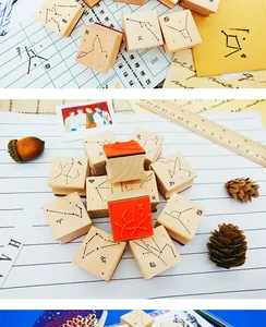 Detailed view of 12 zodiac constellation wooden rubber stamps for DIY bullet journaling