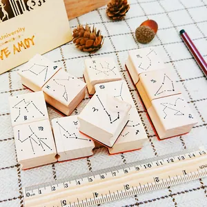 Set of 12 creative wooden zodiac stamps with constellation patterns for DIY journaling