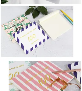 Vue détaillée de planificateurs de 100 jours à fleurs et rayures avec papier de qualité