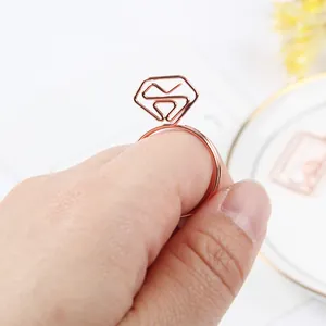 Elegant rose gold diamond ring shaped stainless steel paperclip bookmark held by hand