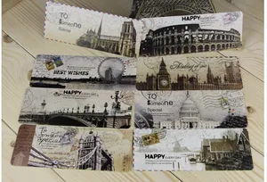 Macro view of vintage style paper bookmarks featuring world landmarks and quotes