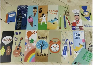 Set of colorful illustrated cardboard bookmarks with various cute cartoon designs