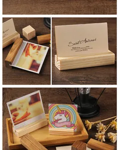 Detailed view of rustic wooden card holders used for photos and memos