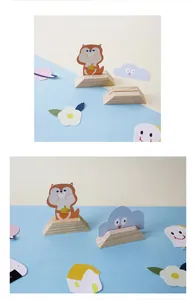 Detail view of wooden trapezoidal memo clips with cute squirrel and cloud cutouts.