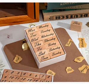 Detailed view of vintage wooden stamps featuring days of the week and numbers for journaling