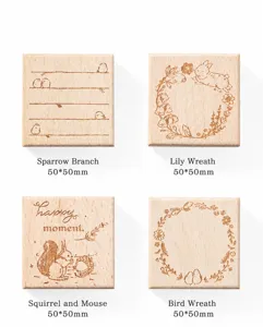 Set of four vintage square wooden stamps with nature and animal engravings for scrapbooking