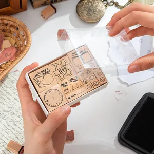 Wooden stamp set for journals featuring date and schedule designs in a clear box
