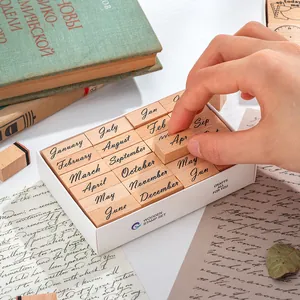 Vintage wooden month stamps set with twelve months for creative journaling and planning