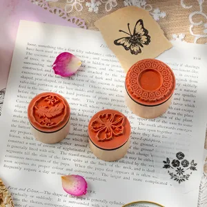 Set of 3 creative wooden cylindrical stamps with floral and feather patterns for DIY journaling