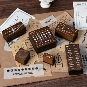 Antikes Holzstempel-Set mit Mondphasen und Kalender für Bullet Journaling und Bastelarbeiten.