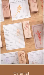 Detailed macro view of botanical wooden stamps featuring elegant floral ink patterns