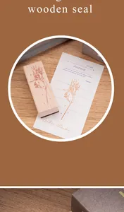 Detailed view of a vintage floral wooden stamp with its print on a decorative paper