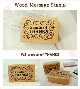 Close-up of vintage wooden DIY message stamp with 'a note of thanks' decorative engraving