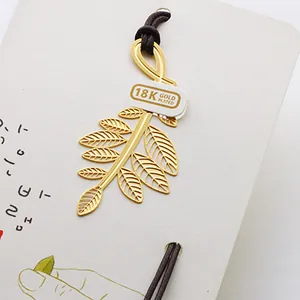 Premium 18K gold plated leaf branch metal bookmark on a decorative gift card display