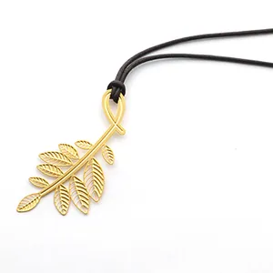 Elegant golden leaf metal bookmark with dark cord, minimalist stationery gift item