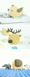 Handcrafted wooden animal music boxes featuring bird, deer and elephant desk decor