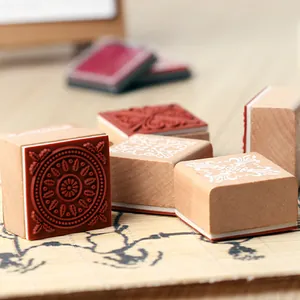 Vintage wooden square stamps set with intricate lace floral patterns for scrapbooking
