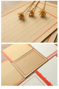 Detail view of vintage Chinese style kraft letter paper with red grid and floral borders