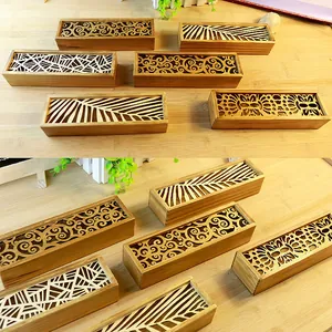 Handcrafted wooden pencil case featuring intricate hollow carved floral and leaf patterns