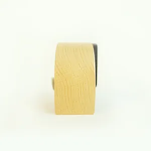 Side view of minimalist wooden animal music box featuring natural wood grain finish