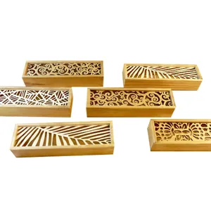 Hollow carved wooden pencil box with intricate laser-cut floral and leaf patterns