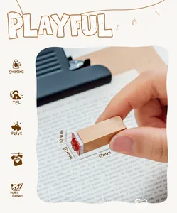 Close-up of a small wooden stamp showing 10mm x 31mm dimensions for DIY crafts