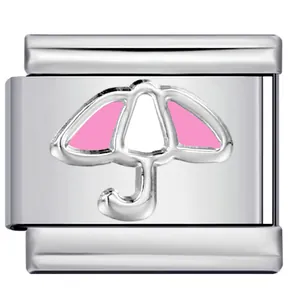 Macro view of stainless steel Italian charm link with pink umbrella pattern